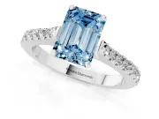 Fancy Blue Emerald Cut Diamond Solitaire Engagement Ring Set in Platinum with Delicate Pavé Band and Prong Setting
