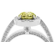 Fancy Yellow Oval Cut Diamond Halo Pavé Split Shank Ring Set in Platinum with Prong Setting
