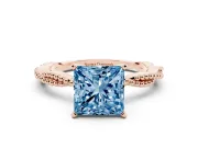 Fancy Blue Princess Cut Diamond Solitaire Ring Set in Rose gold with Twisted Band and Bead Prong Setting