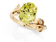 Fancy Yellow Oval Cut Diamond Solitaire Twist Engagement Ring Set in Yellow gold with Pavé Leaf Accents