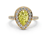 Fancy Yellow Pear Cut Diamond Halo Pavé Engagement Ring Set in Yellow gold with Bezel Setting