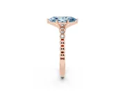 Fancy Blue Marquise Cut Diamond Solitaire Engagement Ring Set in Rose gold with Bezel Accents on Beaded Band