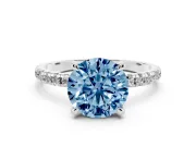 Fancy Blue Round Cut Diamond Brilliant Solitaire Ring Set in Silver with Pavé Band and Prong Setting