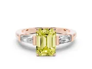 Fancy Yellow Emerald Cut Diamond Solitaire Ring Set in Rose gold with Tapered Baguette Side Stones and Prong Setting