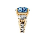 Fancy Blue Three-Stone Round Cut Diamond Pavé Band Ring Set in Yellow gold with Prong-Set Trio