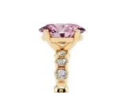 Fancy Pink Oval Cut Diamond Solitaire Engagement Ring Set in Yellow gold with Bezel Accents on Beaded Band