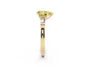 Fancy Yellow Pear Cut Diamond Solitaire Ring Set in Yellow gold with Tapered Baguette Accents and Prong Setting