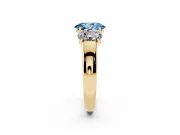 Fancy Blue Three-Stone Oval Cut Diamond Ring Set in Yellow gold with Matching Prong Settings and Plain Band