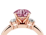 Fancy Pink Three-Stone Round Cut Diamond Ring Set in Rose gold with Prong Setting and Plain Band