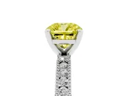 Fancy Yellow Cushion Cut Diamond Solitaire Ring Set in White gold with Slim Pavé Band and Prong Setting