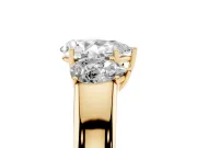 Three-Stone Pear Cut Diamond Ring Set in Yellow gold with Matching Prong Settings and Plain Band