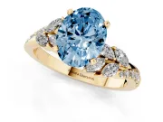 Fancy Blue Oval Cut Diamond Solitaire Ring Set in Yellow gold with Marquise Twist Band and Prong Setting