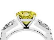 Fancy Yellow Round Cut Diamond Engagement Ring Set in White gold with Baguette Side Stones and Channel Set Band