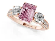 Fancy Pink Emerald Cut Diamond Three-Stone Ring Set in Rose gold with Round Side Stones and Pavé Band