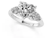 Three-Stone Heart Cut Diamond Ring Set in Platinum with Pear Side Stones and Prong Setting