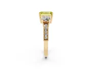 Fancy Yellow Emerald Cut Diamond Three-Stone Ring Set in Yellow gold with Round Side Stones and Pavé Band