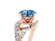 Fancy Blue Round Cut Diamond Solitaire Ring Set in Rose gold with Pavé Twist Band and Secure Prong Setting
