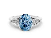 Fancy Blue Three-Stone Oval Cut Diamond Ring Set in Silver with Pear Side Stones and Prong Setting