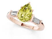 Fancy Yellow Pear Cut Diamond Solitaire Ring Set in Rose gold with Tapered Baguette Accents and Prong Setting