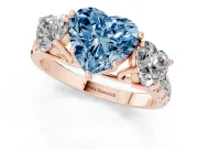 Fancy Blue Heart Cut Diamond Three-Stone Ring Set in Rose gold with Pavé Band