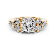 Cushion Cut Diamond Solitaire Ring Set in Yellow gold with Cluster Accents on Each Side