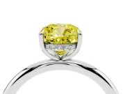 Fancy Yellow Cushion Cut Diamond Solitaire Ring Set in Platinum with Thin Band and Prong Setting