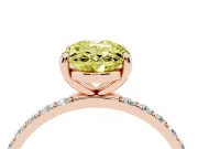 Fancy Yellow Oval Cut Diamond Solitaire Ring Set in Rose gold with Round Pavé Band and Prong Setting