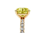 Fancy Yellow Round Cut Diamond Brilliant Solitaire Ring Set in Yellow gold with Pavé Band and Prong Setting