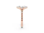 Marquise Cut Diamond Solitaire Engagement Ring Set in Rose gold with Bezel Accents on Beaded Band
