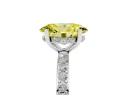 Fancy Yellow Oval Cut Diamond Pavé Band Ring Set in Platinum with Prong-Set Center Stone