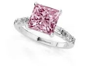 Fancy Pink Princess Cut Diamond Solitaire Set in White gold with Side Baguettes and Channel Set Band