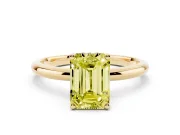 Fancy Yellow Emerald Cut Diamond Solitaire Engagement Ring Set in Yellow gold with Prong Setting and Polished Band