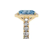 Fancy Blue Emerald Cut Diamond Halo Engagement Ring Set in Yellow gold with Pavé Band and Prong Setting