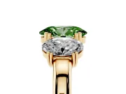 Fancy Green Oval Cut Diamond Three-Stone Ring Set in Yellow gold with Polished Band and Prong Setting