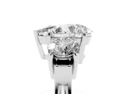 Pear Cut Diamond Three-Stone Ring Set in Platinum with Round Accent Stones and Plain Band