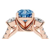 Fancy Blue Three-Stone Cushion Cut Diamond Pavé Band Ring Set in Rose gold with Prong-Set Trio