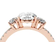 Oval Cut Diamond Three-Stone Ring Set in Rose gold with Pavé Band and Graduated Sides