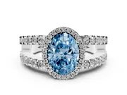 Fancy Blue Oval Cut Diamond Halo Ring Set in Platinum with Pavé Split Shank and Prong Setting