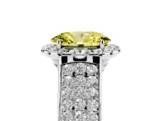 Fancy Yellow Oval Cut Diamond Halo Ring Set in White gold with Pavé Band and Raised Center Setting