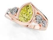 Fancy Yellow Pear Cut Diamond Bezel Bypass Ring Set in Rose gold with Round Accents