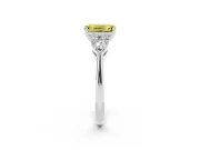 Fancy Yellow Three-Stone Emerald Cut Diamond Ring Set in White gold with Pear Side Stones and Prong Setting
