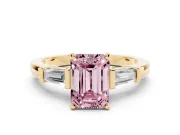 Fancy Pink Emerald Cut Diamond Solitaire Ring Set in Yellow gold with Tapered Baguette Accents and Prong Setting