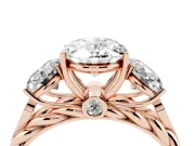 Oval Cut Diamond Three-Stone Ring Set in Rose gold with Braided Band