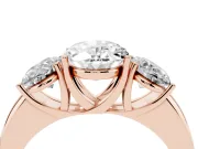 Oval Cut Diamond Three-Stone Ring Set in Rose gold with Bold Center and Classic Band