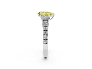 Fancy Yellow Pear Cut Diamond Three-Stone Ring Set in Platinum with Round Side Stones and Delicate Pavé Band