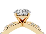 Round Cut Diamond Solitaire Ring Set in Yellow gold with Side Stones on Criss-Cross Band and Prong Setting