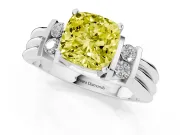 Fancy Yellow Three-Stone Cushion Cut Diamond Channel Set Ring Set in White gold with Bar Prongs