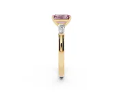 Fancy Pink Emerald Cut Diamond Solitaire Ring Set in Yellow gold with Tapered Baguette Side Stones and Prong Setting