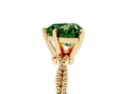 Fancy Green Heart Cut Diamond Solitaire Ring Set in Yellow gold with Twisted Band and Bead Prong Setting