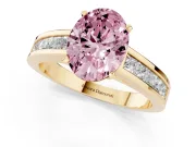 Fancy Pink Oval Cut Diamond Solitaire Ring Set in Yellow gold with Channel-Set Band and Prong Setting